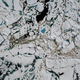Chunks of sea ice, open ponds, and meltwater seen over the Chukchi Sea on Saturday, July 16, 2016. Image: NASA